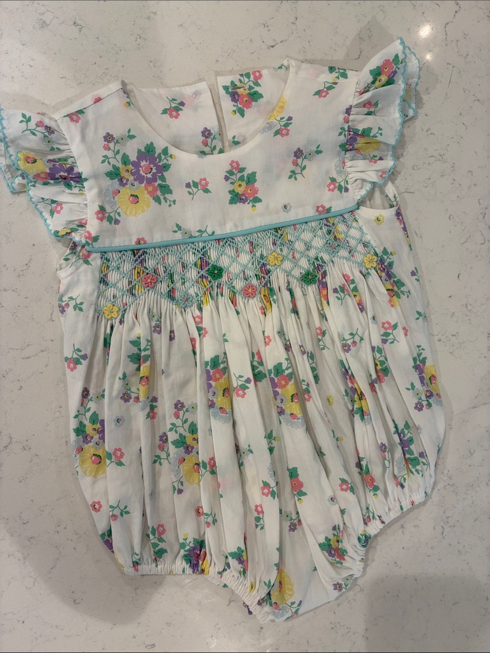 Floral Smocked Baby Romper - White with Yellow, Purple & Green Flowers